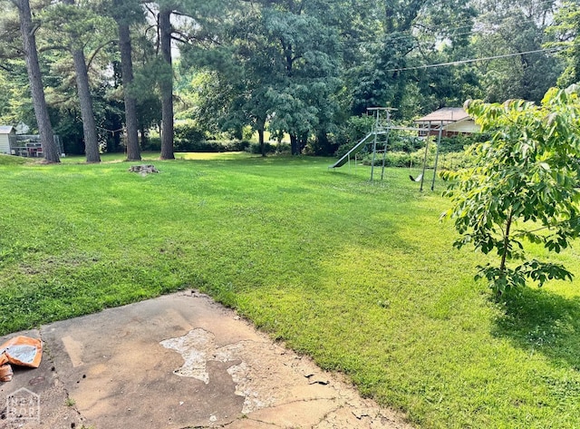 905 Locust Dr, Jonesboro, AR 72401 - view of grassy yard featuring a playground