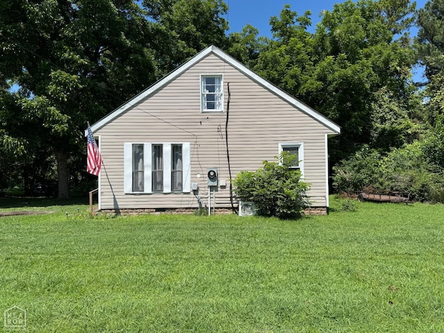 731 S Thornton Ave, Piggott, AR 72454 - back of property featuring a yard and crawl space