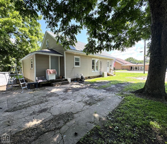 731 S Thornton Ave, Piggott, AR 72454 - back of house with a metal roof