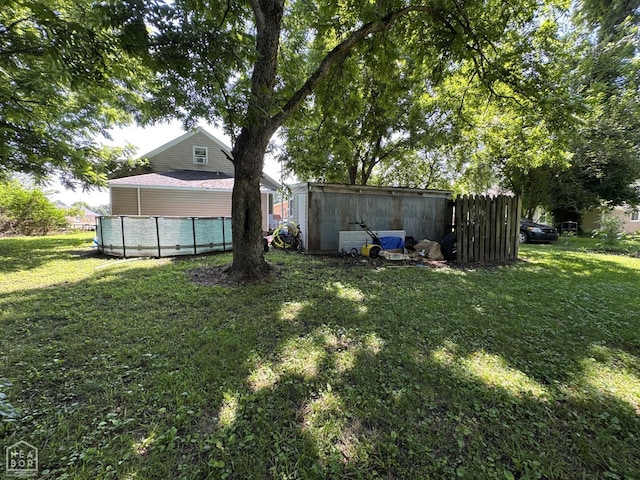 731 S Thornton Ave, Piggott, AR 72454 - view of green lawn with a pool