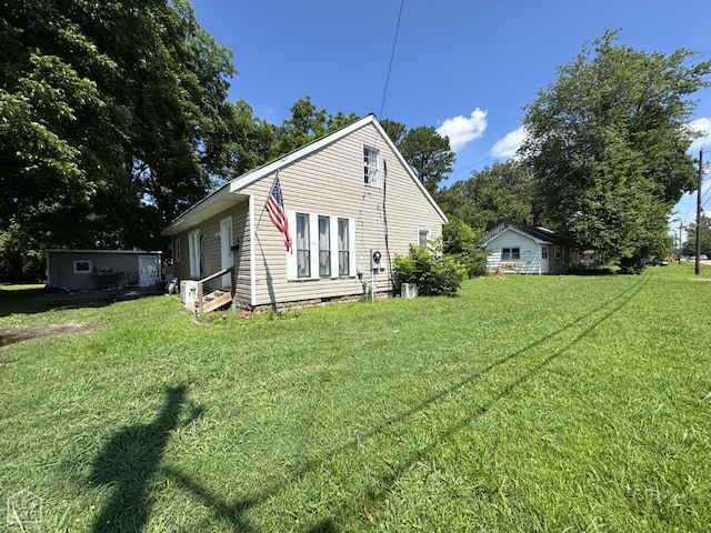 731 S Thornton Ave, Piggott, AR 72454 - back of property featuring a lawn