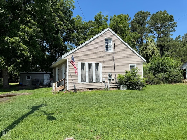 731 S Thornton Ave, Piggott, AR 72454 - back of house with a yard and crawl space