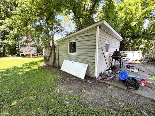 731 S Thornton Ave, Piggott, AR 72454 - view of outbuilding with a trampoline