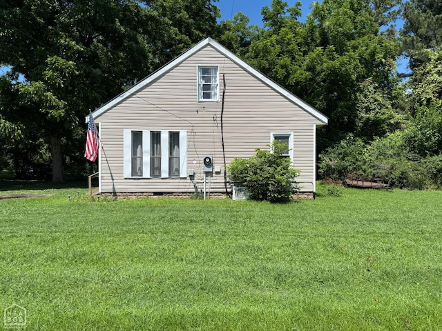 731 S Thornton Ave, Piggott, AR 72454 - rear view of property featuring a yard and crawl space