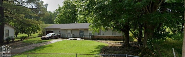 817 Oak Ln, Luxora, AR 72358 - view of front of house with an attached garage, a front lawn, and driveway