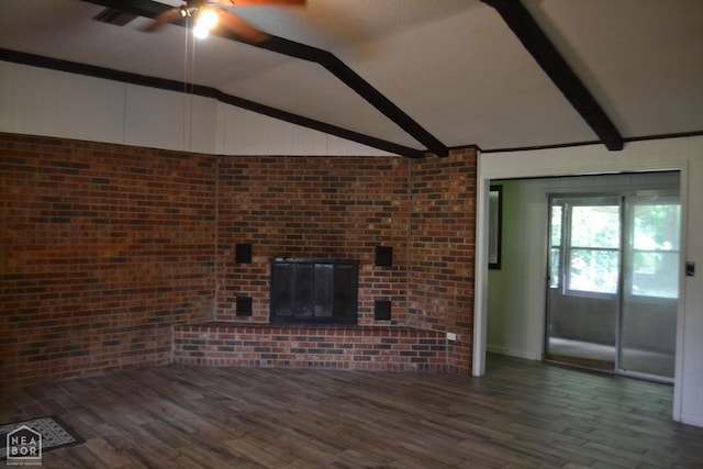 1808 Roy St, Jonesboro, AR 72401 - unfurnished living room featuring a ceiling fan, wood finished floors, a brick fireplace, and brick wall