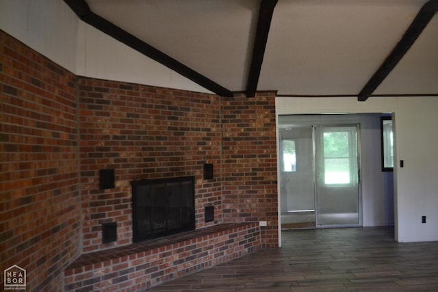 1808 Roy St, Jonesboro, AR 72401 - unfurnished living room featuring wood finished floors and a brick fireplace
