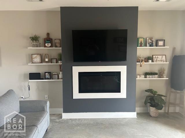 302 Hollis St, Bono, AR 72416 - living area with visible vents and concrete floors