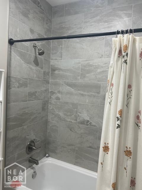 302 Hollis St, Bono, AR 72416 - bathroom with shower / tub combo with curtain