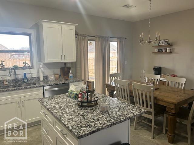 302 Hollis St, Bono, AR 72416 - kitchen with dishwasher, visible vents, a healthy amount of sunlight, and a sink