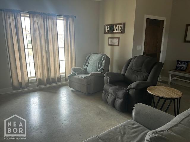 302 Hollis St, Bono, AR 72416 - living area featuring finished concrete flooring