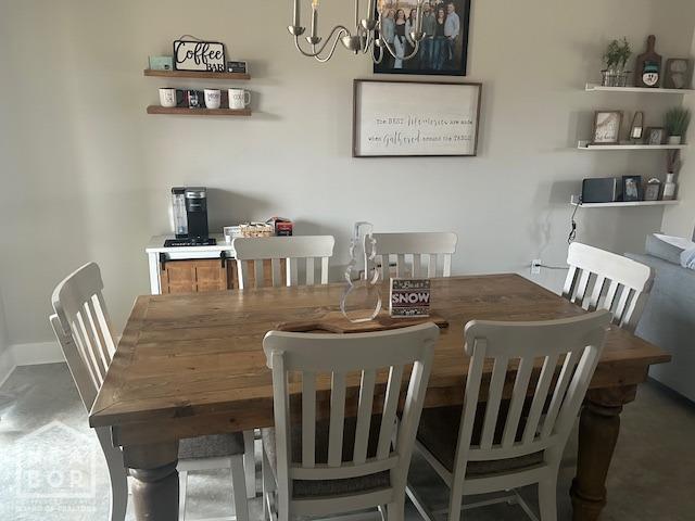 302 Hollis St, Bono, AR 72416 - dining area featuring an inviting chandelier