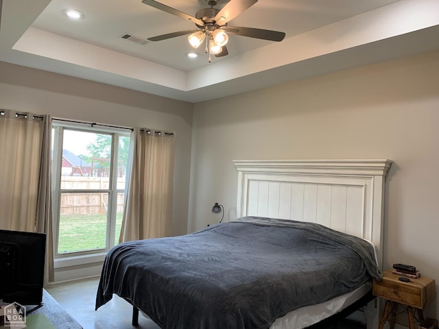 302 Hollis St, Bono, AR 72416 - bedroom with visible vents, recessed lighting, ceiling fan, and a tray ceiling