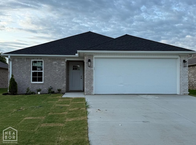 5700 Morgan Dr, Jonesboro, AR 72401 - single story home with driveway, a front lawn, a garage, brick siding, and roof with shingles