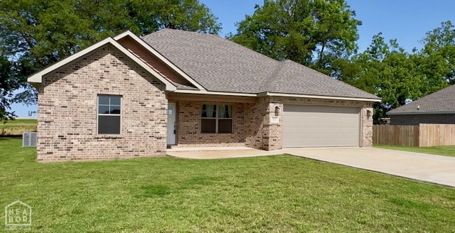 527 Annsley Ln, Manila, AR 72442 - single story home with brick siding, a garage, driveway, central AC unit, and roof with shingles