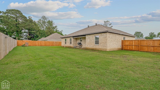 716 Gabe Ln, Manila, AR 72442 - back of house featuring brick siding and a shingled roof