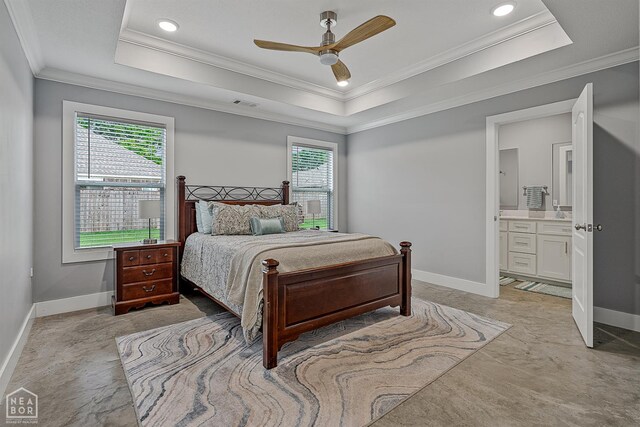 716 Gabe Ln, Manila, AR 72442 - bedroom featuring a raised ceiling, multiple windows, ornamental molding, baseboards, and ensuite bath