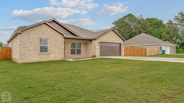 716 Gabe Ln, Manila, AR 72442 - view of front of home with driveway, an attached garage, and brick siding