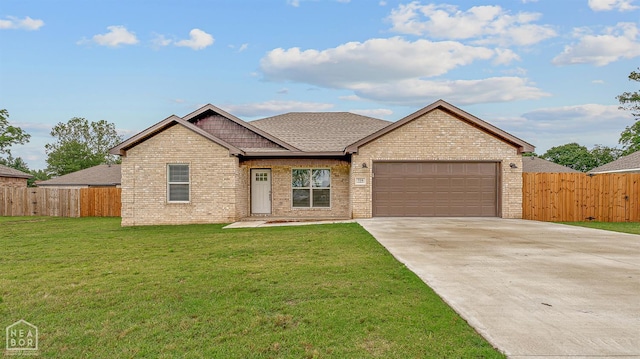 716 Gabe Ln, Manila, AR 72442 - view of front of house with an attached garage, concrete driveway, brick siding, and roof with shingles