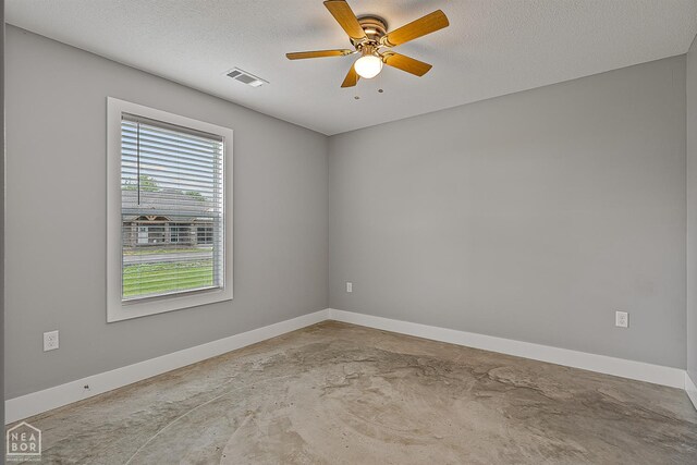 716 Gabe Ln, Manila, AR 72442 - spare room featuring concrete flooring, baseboards, a textured ceiling, and ceiling fan