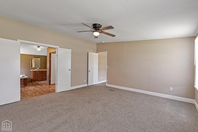 338 Buttercup Ln, Manila, AR 72442 - unfurnished bedroom with carpet flooring, ensuite bathroom, and a ceiling fan