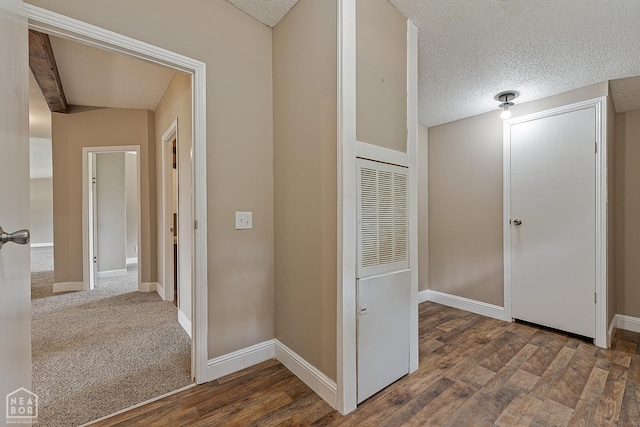 338 Buttercup Ln, Manila, AR 72442 - hallway featuring a heating unit, a textured ceiling, and wood finished floors
