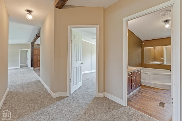 338 Buttercup Ln, Manila, AR 72442 - hallway with light colored carpet