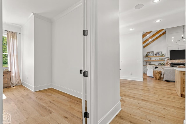 126 County Road 7459, Jonesboro, AR 72401 - hall with light wood finished floors, recessed lighting, crown molding, and a chandelier