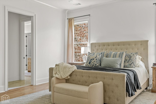 126 County Road 7459, Jonesboro, AR 72401 - bedroom featuring wood finished floors and baseboards
