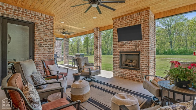 126 County Road 7459, Jonesboro, AR 72401 - view of patio with a ceiling fan, an outdoor living space with a fireplace, and area for grilling
