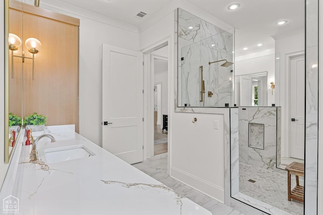 126 County Road 7459, Jonesboro, AR 72401 - bathroom with marble tiled flooring, a marble finish shower, double vanity, recessed lighting, and crown molding