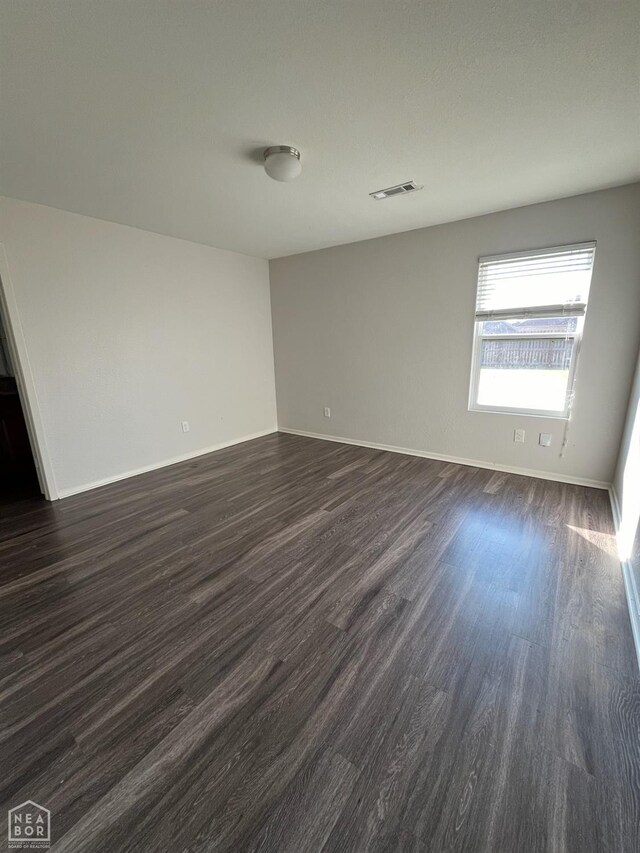 3721 Churchill Dr, Jonesboro, AR 72404 - unfurnished room with dark wood-style flooring and baseboards
