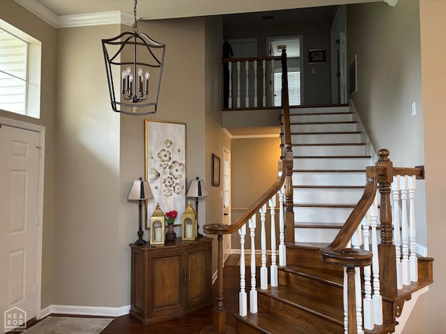 2208 Shafer Cir, Newport, AR 72112 - stairway with a chandelier, wood finished floors, and crown molding