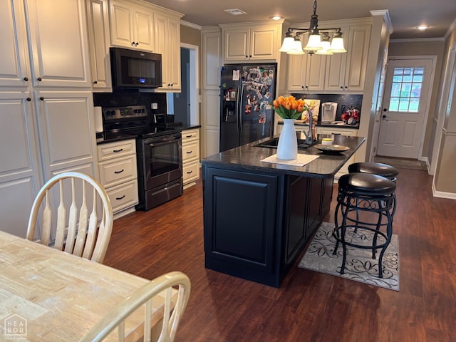 2208 Shafer Cir, Newport, AR 72112 - kitchen with black appliances, dark countertops, dark wood-style flooring, a kitchen bar, and ornamental molding