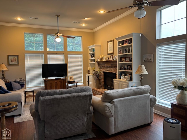 2208 Shafer Cir, Newport, AR 72112 - living room with ceiling fan, dark wood-style flooring, a fireplace, ornamental molding, and recessed lighting