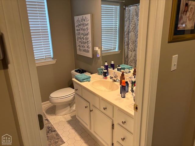 2208 Shafer Cir, Newport, AR 72112 - bathroom featuring vanity, tile patterned flooring, healthy amount of natural light, and a shower with curtain