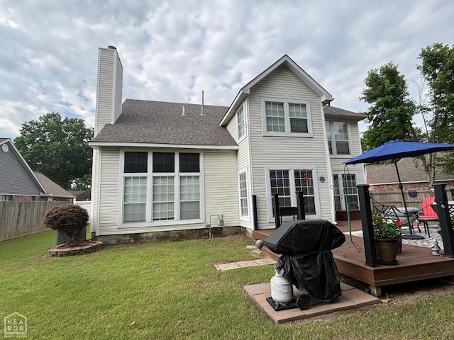 2208 Shafer Cir, Newport, AR 72112 - back of house with a wooden deck, a chimney, and roof with shingles