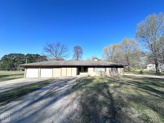 420 N 12th Ave, Piggott, AR 72454 - ranch-style house featuring an attached garage, concrete driveway, a front lawn, and a chimney