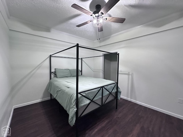 420 N 12th Ave, Piggott, AR 72454 - bedroom featuring wood finished floors, a textured ceiling, a ceiling fan, and crown molding