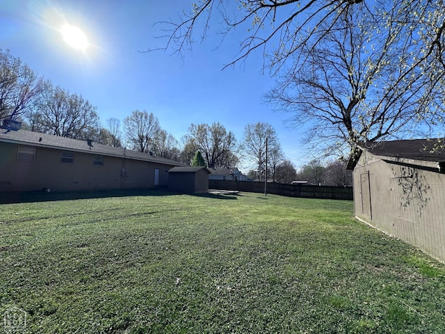 420 N 12th Ave, Piggott, AR 72454 - view of yard featuring a storage unit