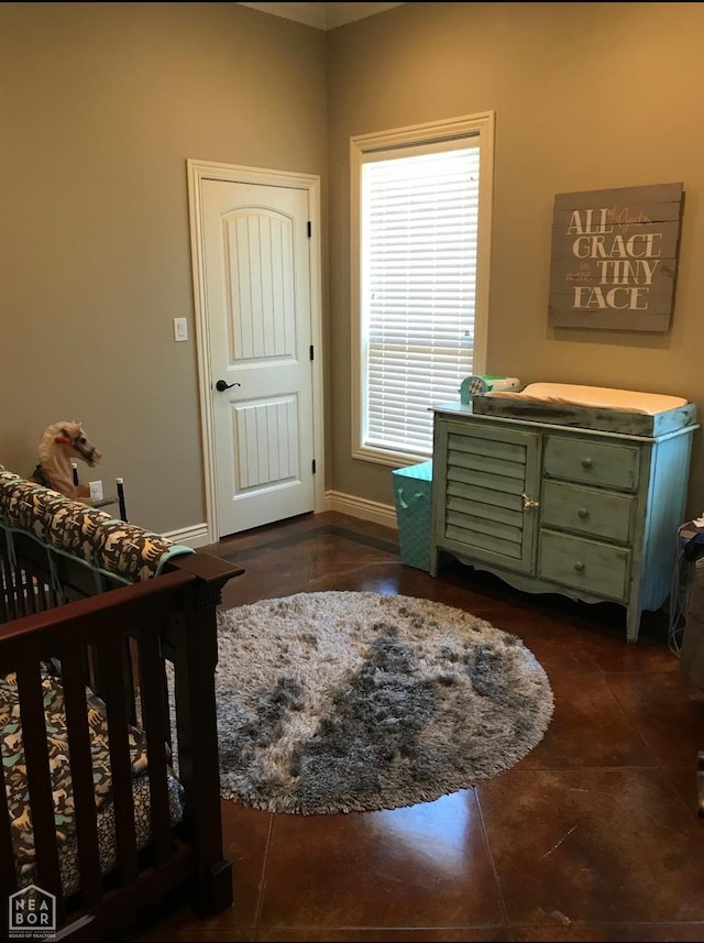 bedroom featuring baseboards