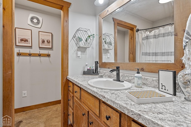 4837 Peachtree Ave, Jonesboro, AR 72405 - bathroom with ornamental molding, visible vents, baseboards, and vanity