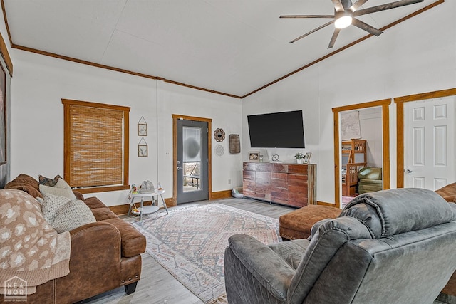 4837 Peachtree Ave, Jonesboro, AR 72405 - living room with baseboards, vaulted ceiling, ornamental molding, a ceiling fan, and wood finished floors