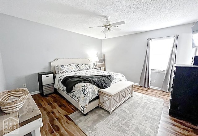 199 County Road 305, Jonesboro, AR 72401 - bedroom featuring baseboards, wood finished floors, a ceiling fan, and a textured ceiling
