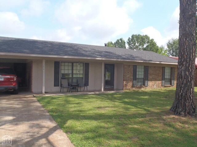 2009 Daugherty St, Newport, AR 72112 - single story home featuring driveway, an attached carport, and a front lawn