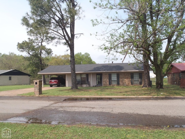2009 Daugherty St, Newport, AR 72112 - single story home with concrete driveway, a front yard, and an attached carport