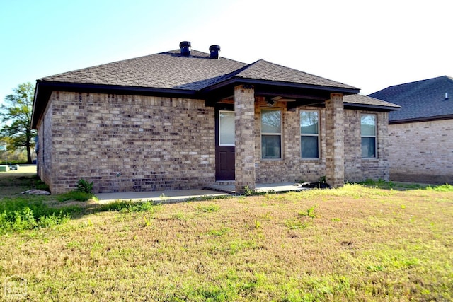 5632 Brookshire Dr, Jonesboro, AR 72405 - view of front of property with a front lawn, roof with shingles, and brick siding