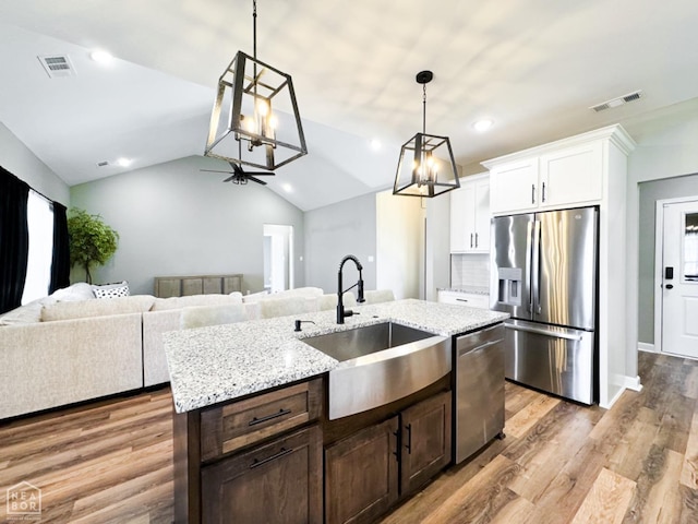 109 Old Eli Rd, Monette, AR 72447 - kitchen featuring white cabinetry, appliances with stainless steel finishes, a sink, and visible vents