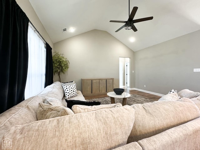 109 Old Eli Rd, Monette, AR 72447 - living room featuring vaulted ceiling, baseboards, visible vents, wood finished floors, and ceiling fan