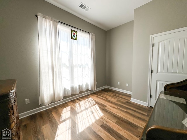 109 Old Eli Rd, Monette, AR 72447 - unfurnished bedroom featuring visible vents, wood finished floors, and baseboards